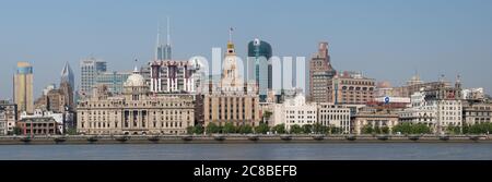 Shanghai, China - April 19, 2018: Panorama of historical buildings at the Bund (Waitan). With HSBC building and Customs House. Huanpu River in the for Stock Photo