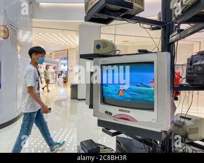 Zhengzhou, ZhengZhou, China. 23rd July, 2020. HenanÃ¯Â¼Å'CHINA-On July 13, a businessman set up an ''antique screen tree'' in Zhengzhou, Henan province. About 20 old TV sets from different eras were placed on the shelf to play cartoons, TV dramas and other films on a loop, attracting many citizens to watch, and the ''retro and nostalgic style'' appeared.These old televisions, both in colour and in black and white; There are tube TV sets, transistor TV sets, and integrated circuit TV sets. From the point of view of the period, are the last century's popular model of television. This setting is Stock Photo