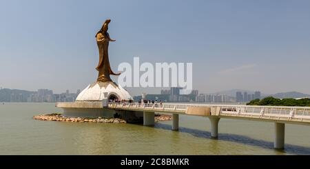 Macao, China - May 27, 2017: Panorama view on Kun Iam statue. The sculpture is 32 meters high and made of bronze. Buddhist bodhisattva also known as G Stock Photo