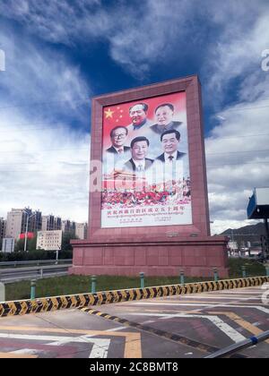 Lhasa, Tibet / China - Jul 29, 2017: Photo of huge poster with faces of Chinese presidents. Erected to celebrate the 50th anniversary of the foundatio Stock Photo