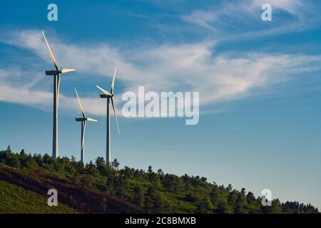 Wind turbines on a hill Stock Photo