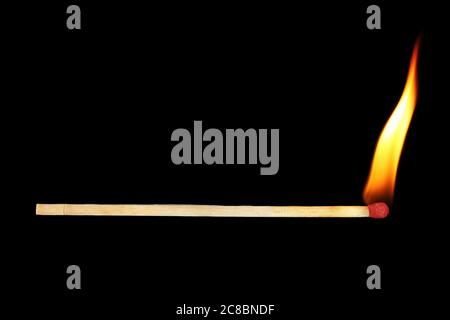 lit match isolated on black Stock Photo