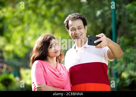 Indian couple on a video call using mobile phone Stock Photo