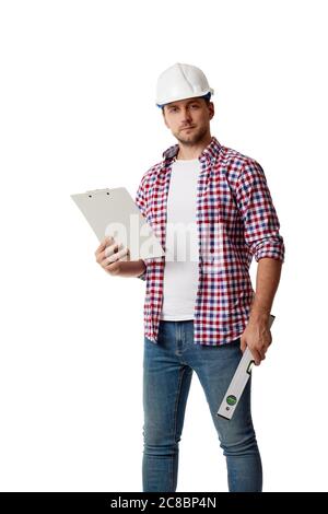 industrial engineer in hard hat holding clipboard. builder in shirt looking at the camera isolated on white studio background Stock Photo