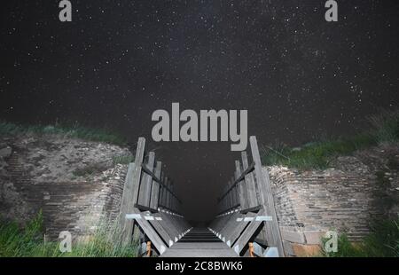 (200723) -- ZHENGLAN BANNER, July 23, 2020 (Xinhua) -- Photo taken on July 23, 2020 shows the site of Xanadu under the starry sky in Zhenglan Banner of Xilingol League, north China's Inner Mongolia Autonomous Region. Located in Zhenglan Banner of Xilingol League, north China's Inner Mongolia Autonomous Region, the relic site of Xanadu, or Yuan Shangdu ruins, is one of the best preserved sites of the capital cities of Yuan Dynasty (1271-1368) in China. Listed by UNESCO as a World Cultural Heritage Site in 2012, site of Xanadu is resulted from the clashing and blending of grassland culture, farm Stock Photo