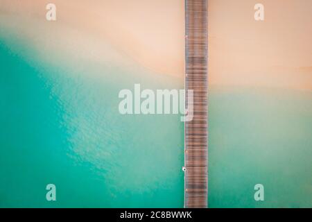 Amazing bird eyes view in Maldives, landscape of coast or shore, sunrise soft light, long wooden jetty Stock Photo