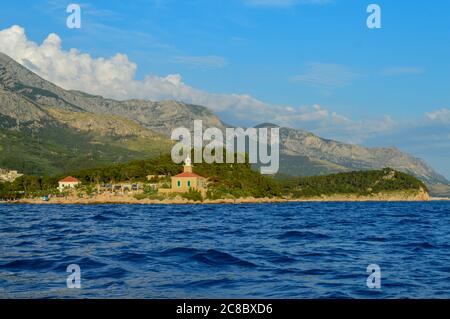 MAKARSKA, CROATIA - JUNE 17: Lighthouse on Makarska riviera beach in Makarska, Croatia on June 17, 2019. Stock Photo