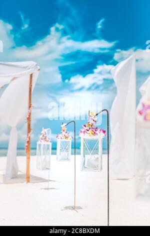 Wedding set up on beach. Tropical outdoor wedding party on beach. Romantic wedding setting on the beach. Stock Photo
