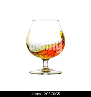 A filled cognac snifter with moving liquid isolated on white Stock Photo
