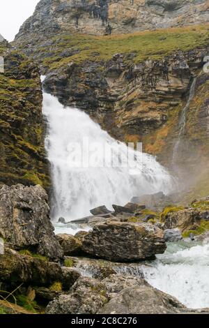 Amazing waterfall with lots of water falling on a cloudy day. Stock Photo