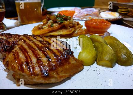 Delicious appetizing steak on a plate in a beer bar Stock Photo