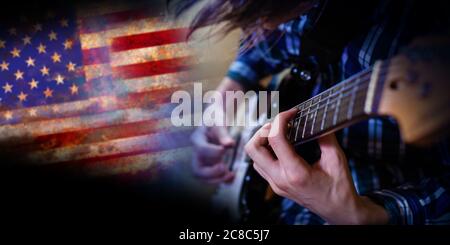 Electric guitar man playing on US flag background. Closeup Photography.