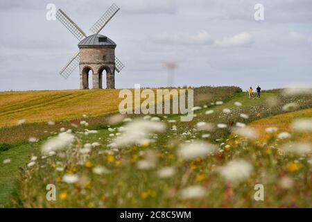 Visitors walk by Chesterton Windmill in Chesterton, Warwickshire. Stock Photo