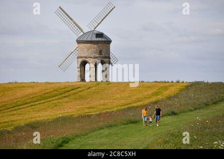 Visitors walk by Chesterton Windmill in Chesterton, Warwickshire. Stock Photo