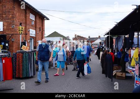 Rye, East Sussex, UK. 23 Jul, 2020. Coronavirus update: Tourists to the ancient town of Rye in East Sussex continue to arrive. The Thursday market is proving popular on some stalls selling Coronavirus masks as the government’s new measures come into force tomorrow Friday. Some of the visitors wearing masks. Photo Credit: Paul Lawrenson-PAL Media/Alamy Live News Stock Photo