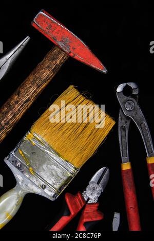 Needle-nose pliers, hammer, screwdriver, Philips screwdriver, color brush and pliers. Stock Photo