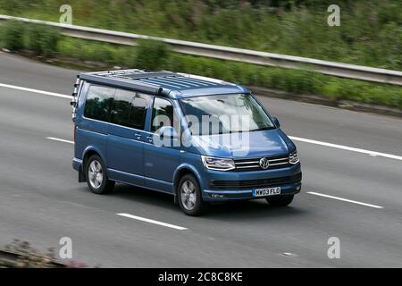 A 2017 Volkswagen VW California Ocean Tdi Blue Car Large MPV Diesel driving on the M6 motorway near Preston in Lancashire, UK Stock Photo