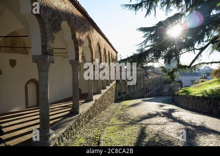 The ascent of the hill leading to the castle of Udine, Italy, in the late afternoon light Stock Photo