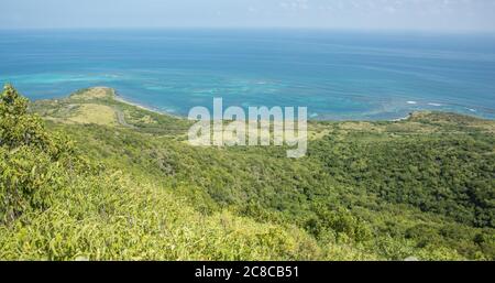 Elevated view over the Caribbean Sea coastline with rolling hills from the top of Goat Hill on St. Croix in the USVI Stock Photo