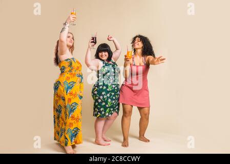 Group of 3 oversize women posing in studio - Beautiful girls accepting body imperfection, beauty shots in studio - Concepts about body acceptance, bod Stock Photo