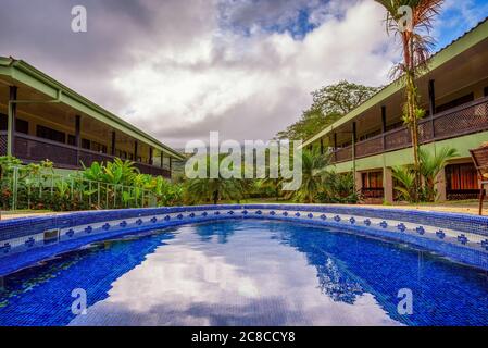 La Fortuna, Costa Rica - January 16, 2020 : Hotel Lavas Tacotal with an outdoor pool. It is located in La Fortuna and offers excellent views of Arenal