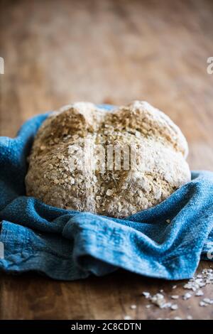 Rustic Irish Soda Bread topped with oats fresh out of the oven Stock Photo