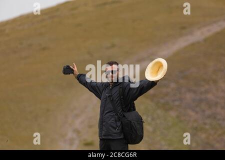 A young man enjoys a walk in the middle of nature, towards the cold summit of Moncayo, the highest mountain in the Iberian System, in the Tarazona reg Stock Photo