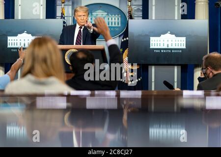 U.S. President Donald Trump with members of his administration delivers ...