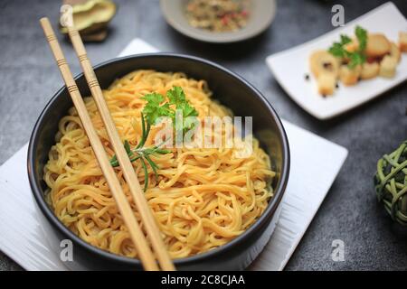 Chinese soup on black background, chinese pasta bowl Stock Photo