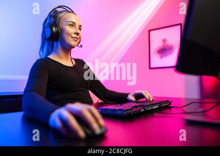 Happy Pretty Blonde Gamer Girl Playing Online Video Game on Her Personal  Computer Stock Photo - Alamy