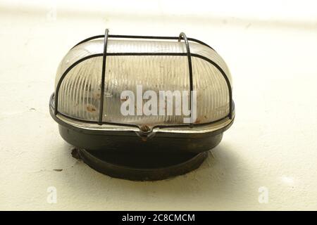 Antique lamp, used in open areas, with base in black iron and rough glass for internal light placement, photo zoom, Brazil, South America, waterproof Stock Photo