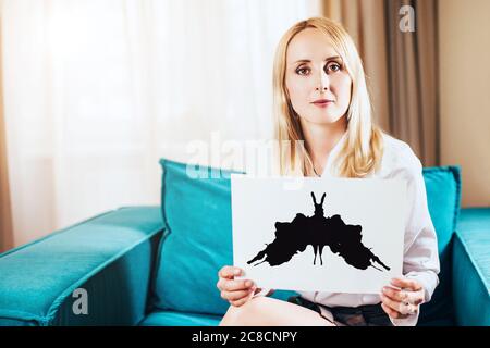 Psychological consultation with a slim elegant woman psychologist - Rorschach associative spot test Stock Photo