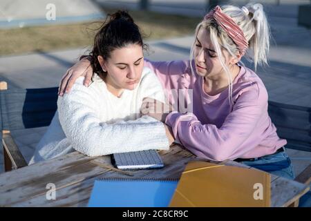 One Teenage woman Comforting Another After Break Up Stock Photo