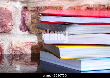 Stack of reading books on a glass table Stock Photo