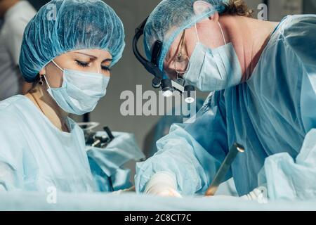 two surgeons at work in operating room. close up Stock Photo