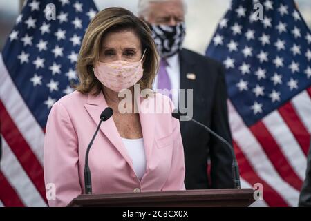 Washington, United States. 23rd July, 2020. Speaker of the House Nancy Pelosi, D-Calif., participates in a bill enrollment ceremony for the Great American Outdoors Act on the West Front of the U.S. Capitol in Washington, DC, U.S., on Thursday, July 23, 2020. The act will fund maintenance projects for national parks and forests. Photo by Sarah Silbiger/UPI Credit: UPI/Alamy Live News Stock Photo