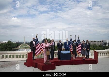 Washington, United States. 23rd July, 2020. Speaker of the House Nancy Pelosi, D-Calif., participates in a bill enrollment ceremony for the Great American Outdoors Act on the West Front of the U.S. Capitol in Washington, DC, U.S., on Thursday, July 23, 2020. The act will fund maintenance projects for national parks and forests. Photo by Sarah Silbiger/UPI Credit: UPI/Alamy Live News Stock Photo