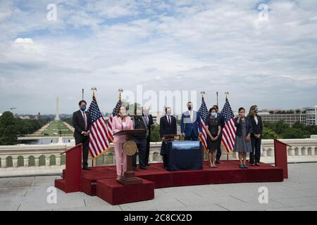 Washington, United States. 23rd July, 2020. Speaker of the House Nancy Pelosi, D-Calif., participates in a bill enrollment ceremony for the Great American Outdoors Act on the West Front of the U.S. Capitol in Washington, DC, U.S., on Thursday, July 23, 2020. The act will fund maintenance projects for national parks and forests. Photo by Sarah Silbiger/UPI Credit: UPI/Alamy Live News Stock Photo