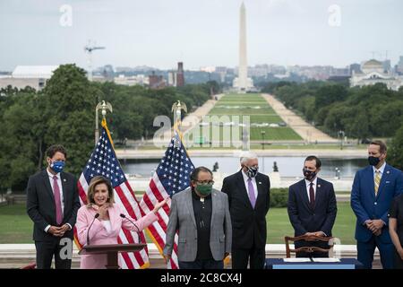 Washington, United States. 23rd July, 2020. Speaker of the House Nancy Pelosi, D-Calif., participates in a bill enrollment ceremony for the Great American Outdoors Act on the West Front of the U.S. Capitol in Washington, DC, U.S., on Thursday, July 23, 2020. The act will fund maintenance projects for national parks and forests. Photo by Sarah Silbiger/UPI Credit: UPI/Alamy Live News Stock Photo