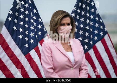 Washington, United States. 23rd July, 2020. Speaker of the House Nancy Pelosi, D-Calif., participates in a bill enrollment ceremony for the Great American Outdoors Act on the West Front of the U.S. Capitol in Washington, DC, U.S., on Thursday, July 23, 2020. The act will fund maintenance projects for national parks and forests. Photo by Sarah Silbiger/UPI Credit: UPI/Alamy Live News Stock Photo