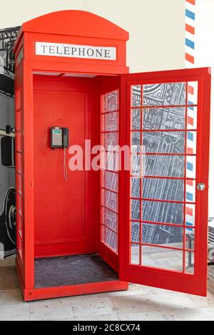 Open Door at Red Telephone Box Not Original Stock Photo