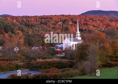 Mountain village during the peak of autumn colour season in New England at dusk Stock Photo