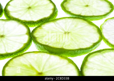 Green lime slices isolated on white background. Stock Photo