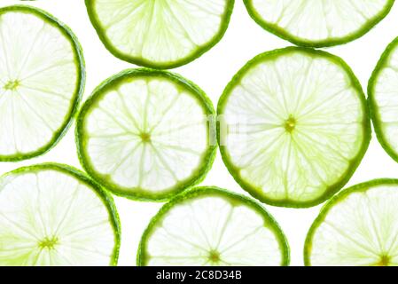 Green lime slices isolated on white background. Stock Photo
