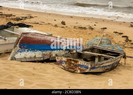 Two weathered dhows on the sandy beach Maputo, Mozambique, in the Early morning Stock Photo