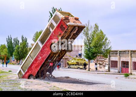 Wrecked bus in the oil town of Aksai, Jiuquan, Gansu, China Stock Photo