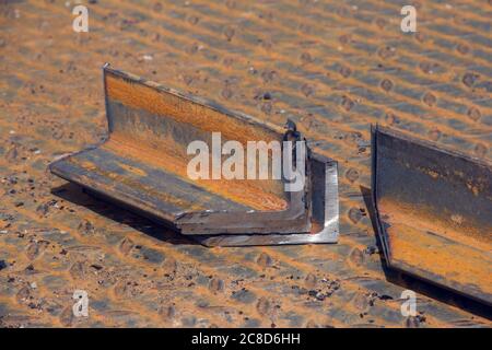 Steel piece from the corner. Metalworking. Processing in a locksmith's workshop Stock Photo