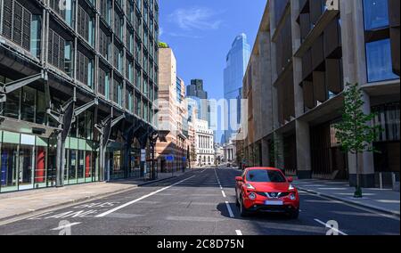 One Car Driving Through City of London Stock Photo
