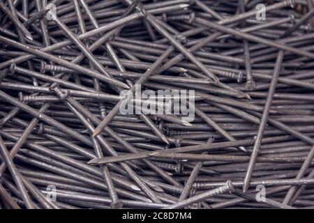 Construction nails during the construction of a wooden house. Building accessories nails Stock Photo