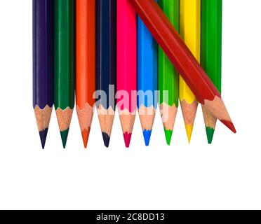 Red color wood pencil crayon placed on top of a row of different color wood pencil crayon Stock Photo